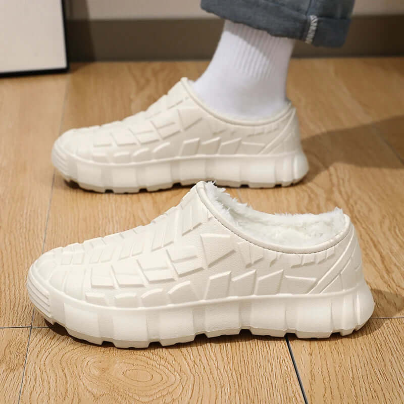 Fleece-lined waterproof shoes in white, perfect for winter, showcasing comfortable and warm footwear for outdoor activities.