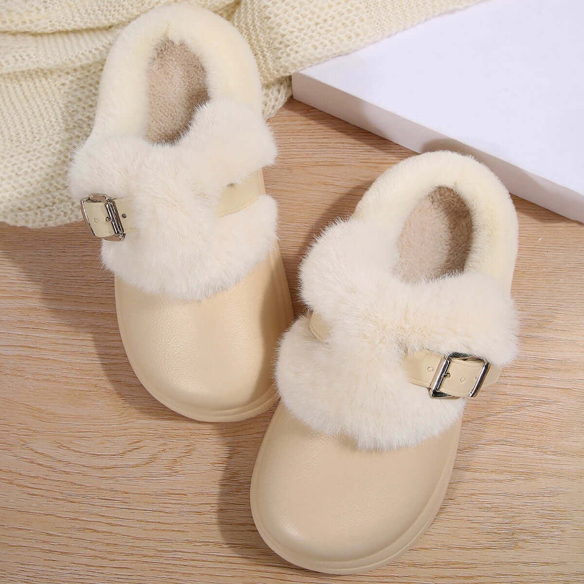Waterproof furry clogs on wet surface showing water-resistant EVA material