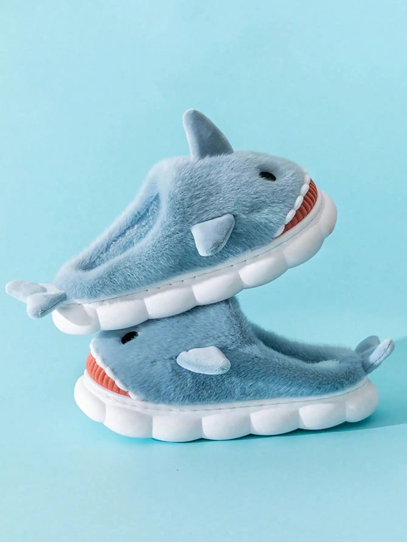 Soft cushioned interior of cartoon shark slippers for all-day comfort