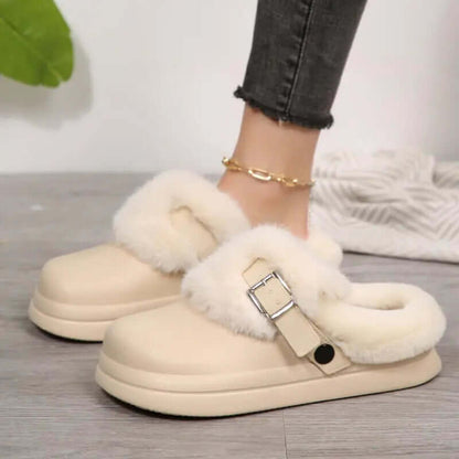 Top view of waterproof furry clogs featuring fluffy fur interior and buckle detail