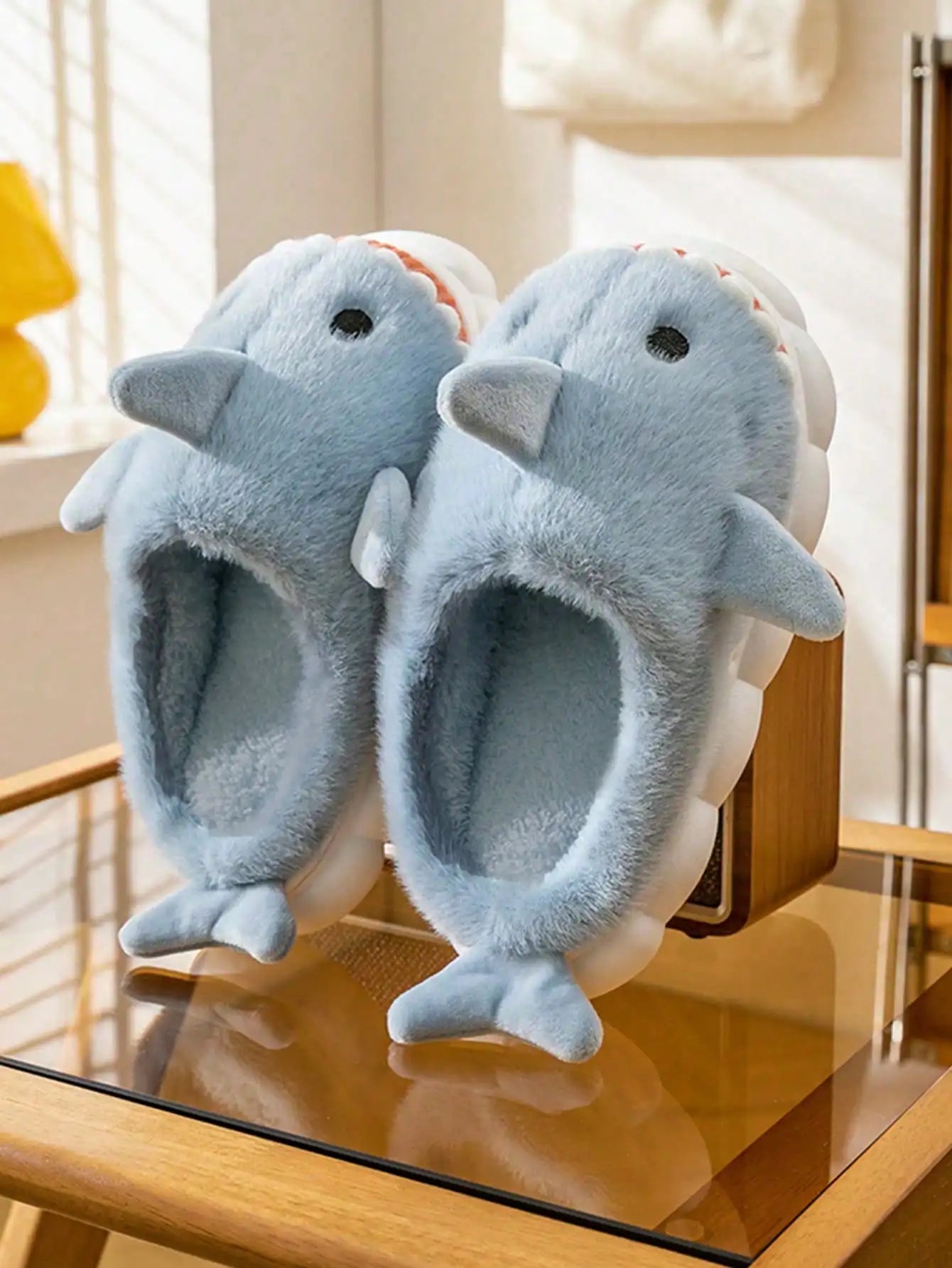Top view of cartoon shark slippers featuring warm plaid cotton pattern