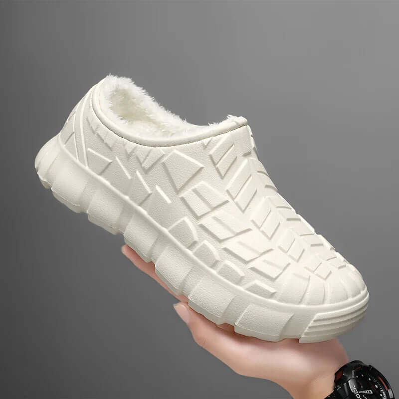 Fleece-Lined Waterproof Shoes in cream color held in hand, featuring a textured design for winter comfort.