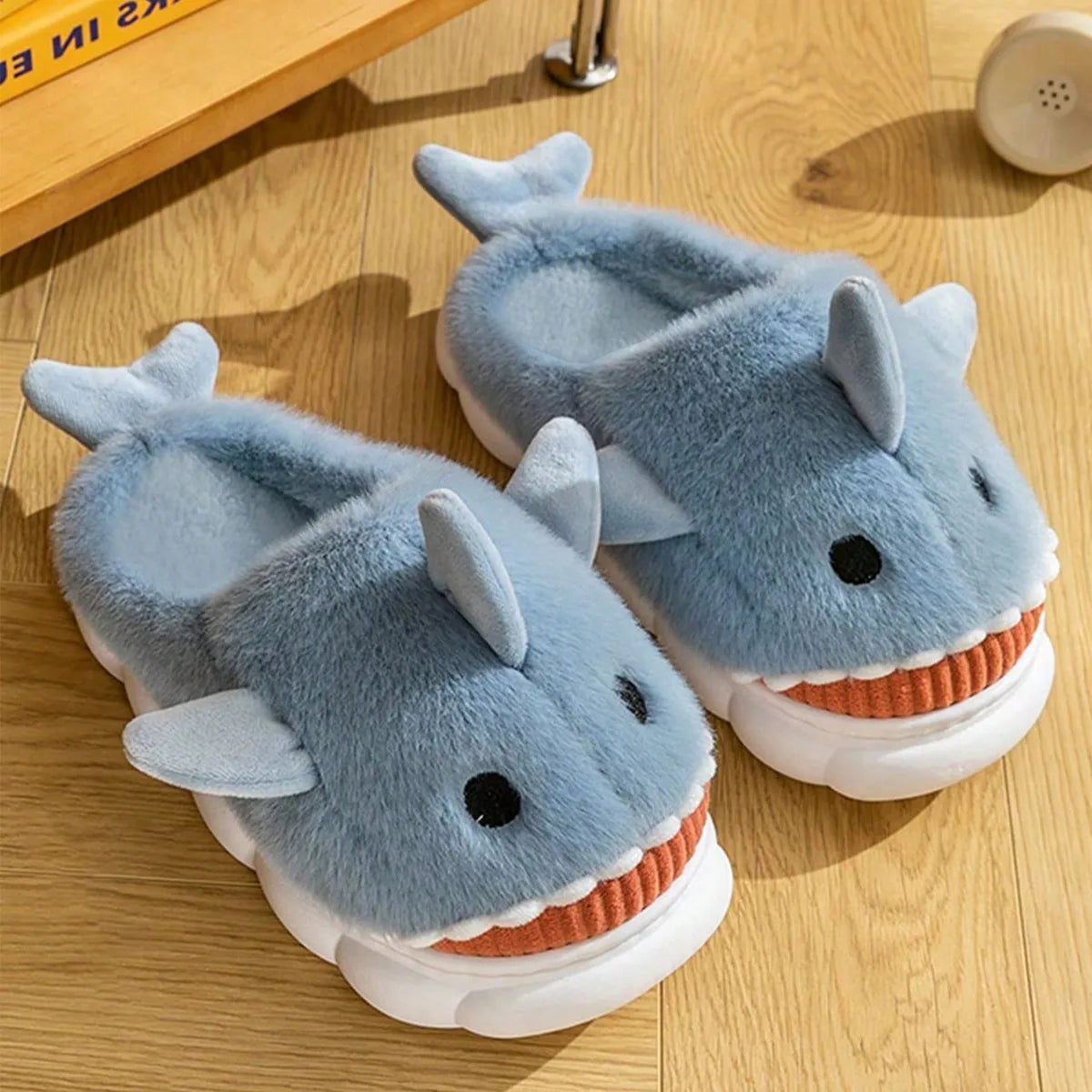 Cartoon shark slippers shown from multiple angles displaying unique design