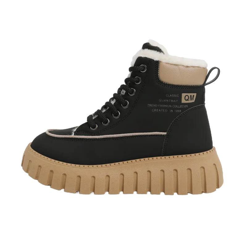 Black boot with tan sole on a white background