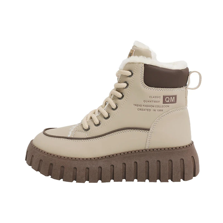 Beige winter boot with brown sole on a white background