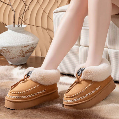 Woman wearing fluffy platform slippers indoors for winter comfort