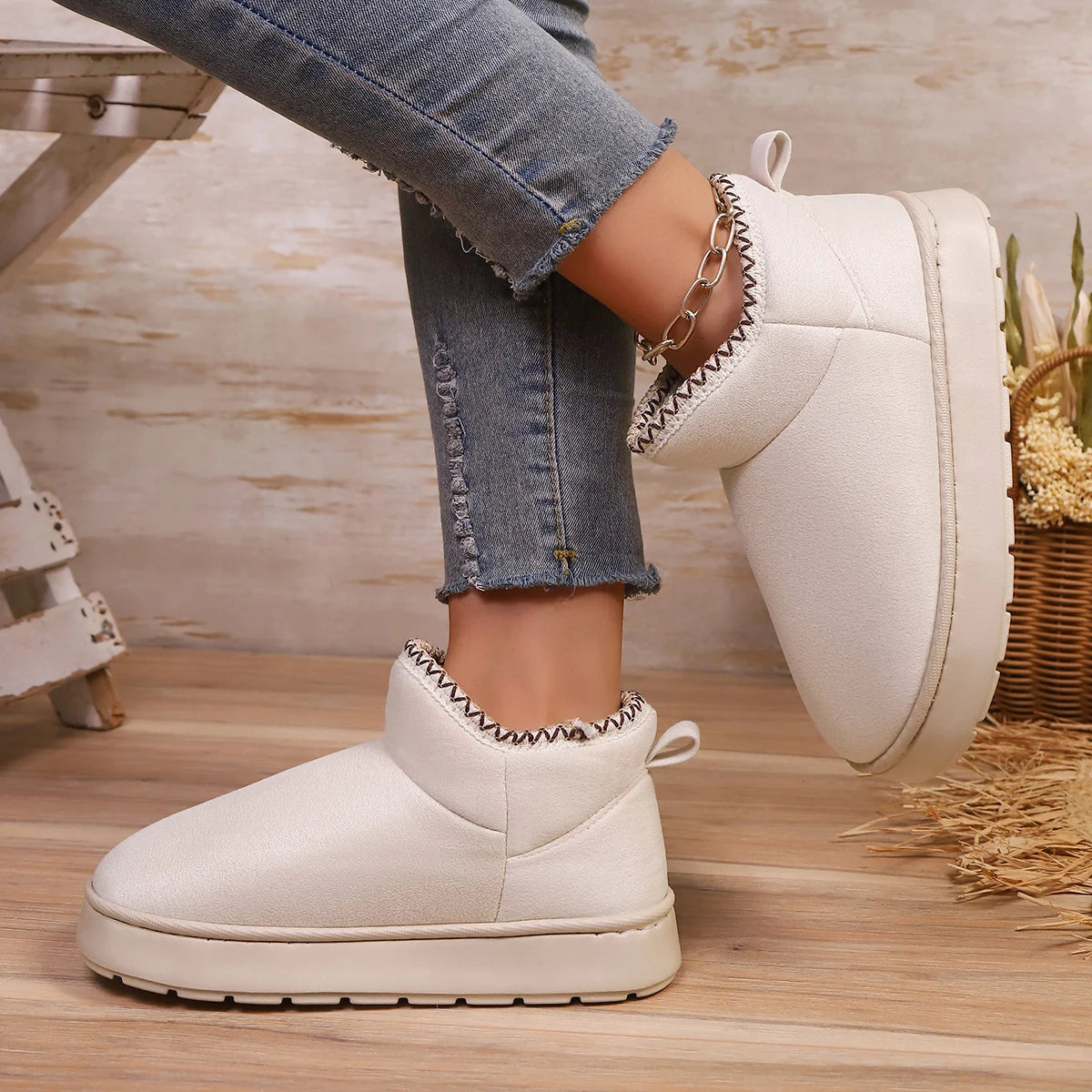 Woman wearing EvaCozy warm winter slippers at home in Canada