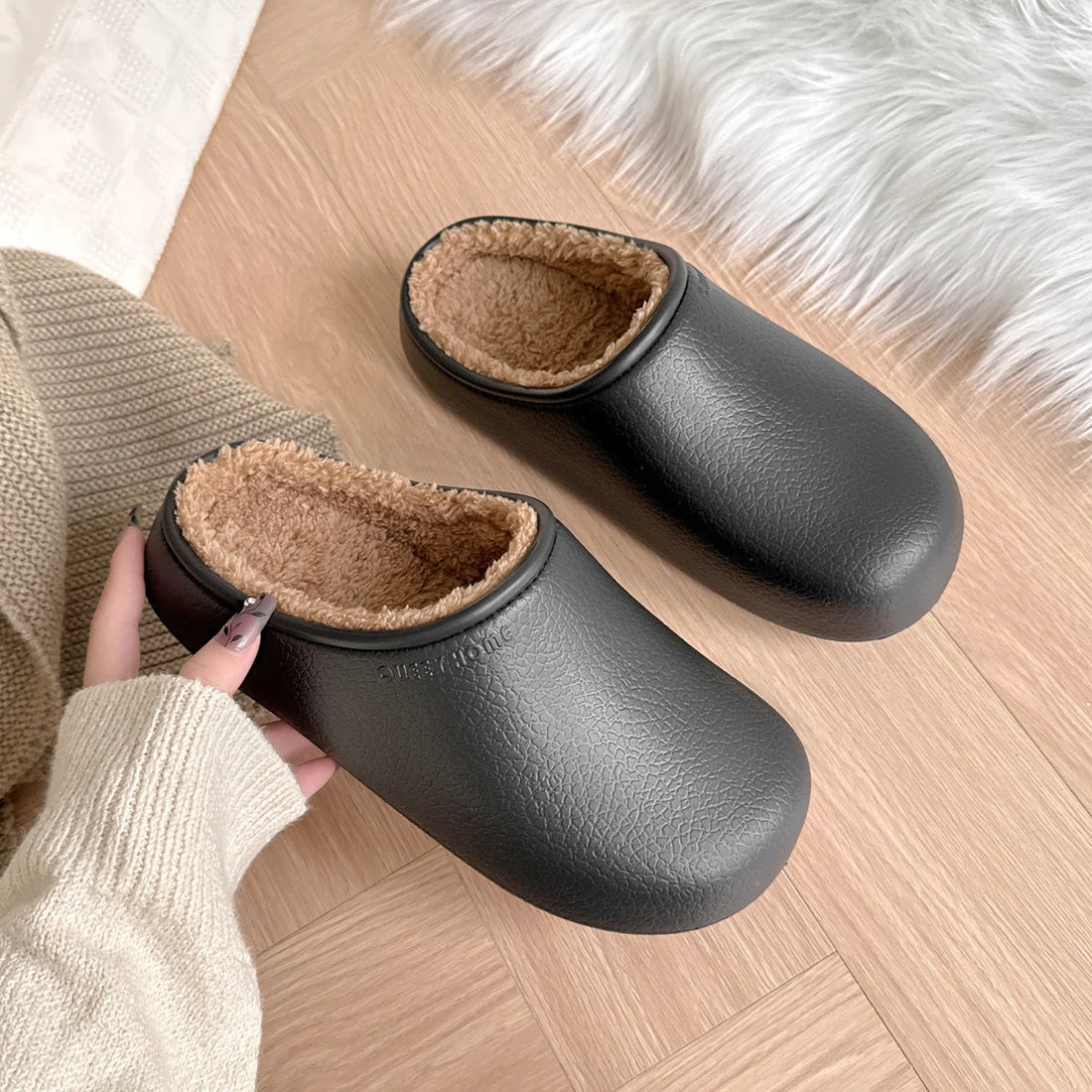 Women’s waterproof winter slippers in a soft, minimalist pastel cream colorway