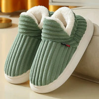 Woman wearing EvaCozy winter plush slippers for ultimate home comfort