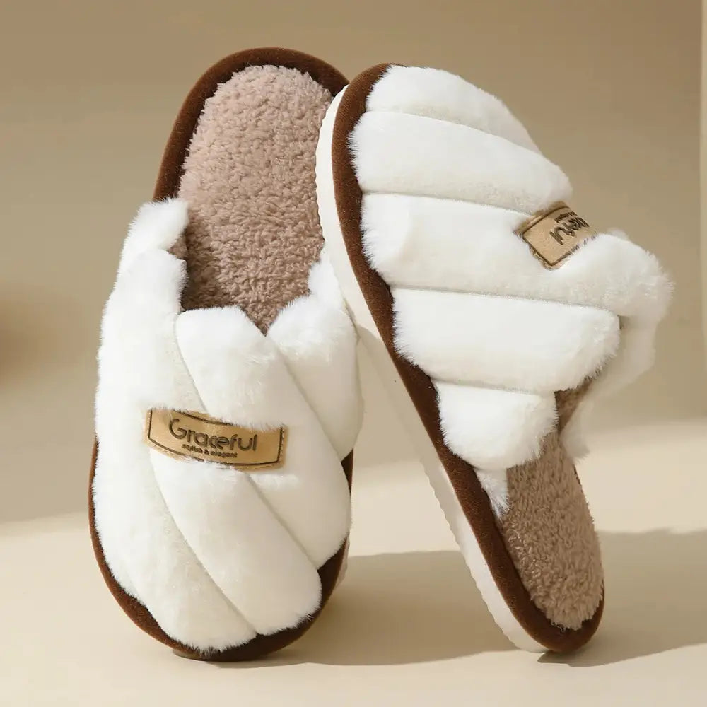 White plush slippers with flat heel, lightweight cushioned sole and braided design