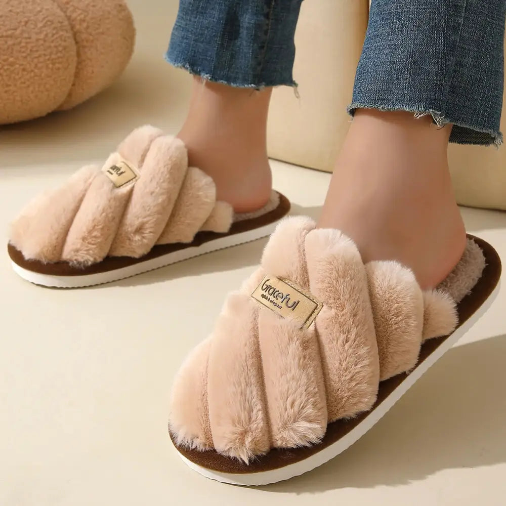 Pink fluffy slippers in solid color with flat heel and lightweight cushioned sole