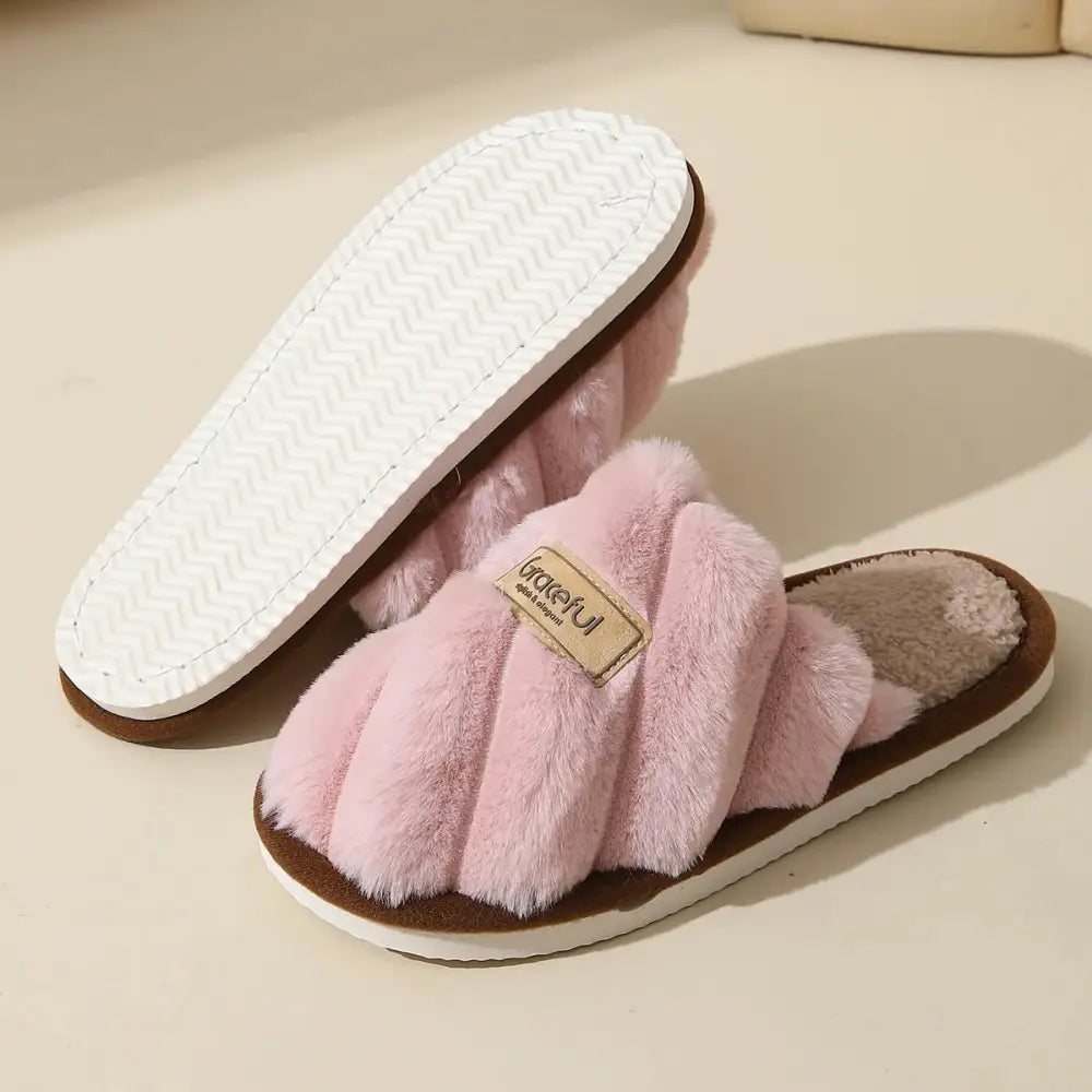 Pink fluffy slippers in solid color with flat heel and lightweight cushioned sole